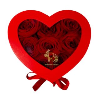 Heart shaped box with roses and candies